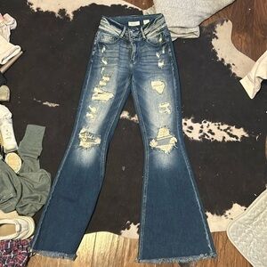 women’s ripped flared jeans